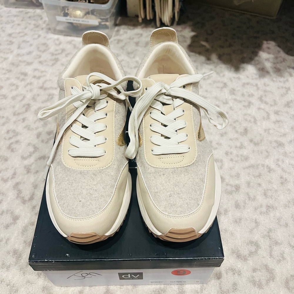 Dolce Vita Bossy Oatmeal with gold logo  Women's Cream and Tan Sneakers